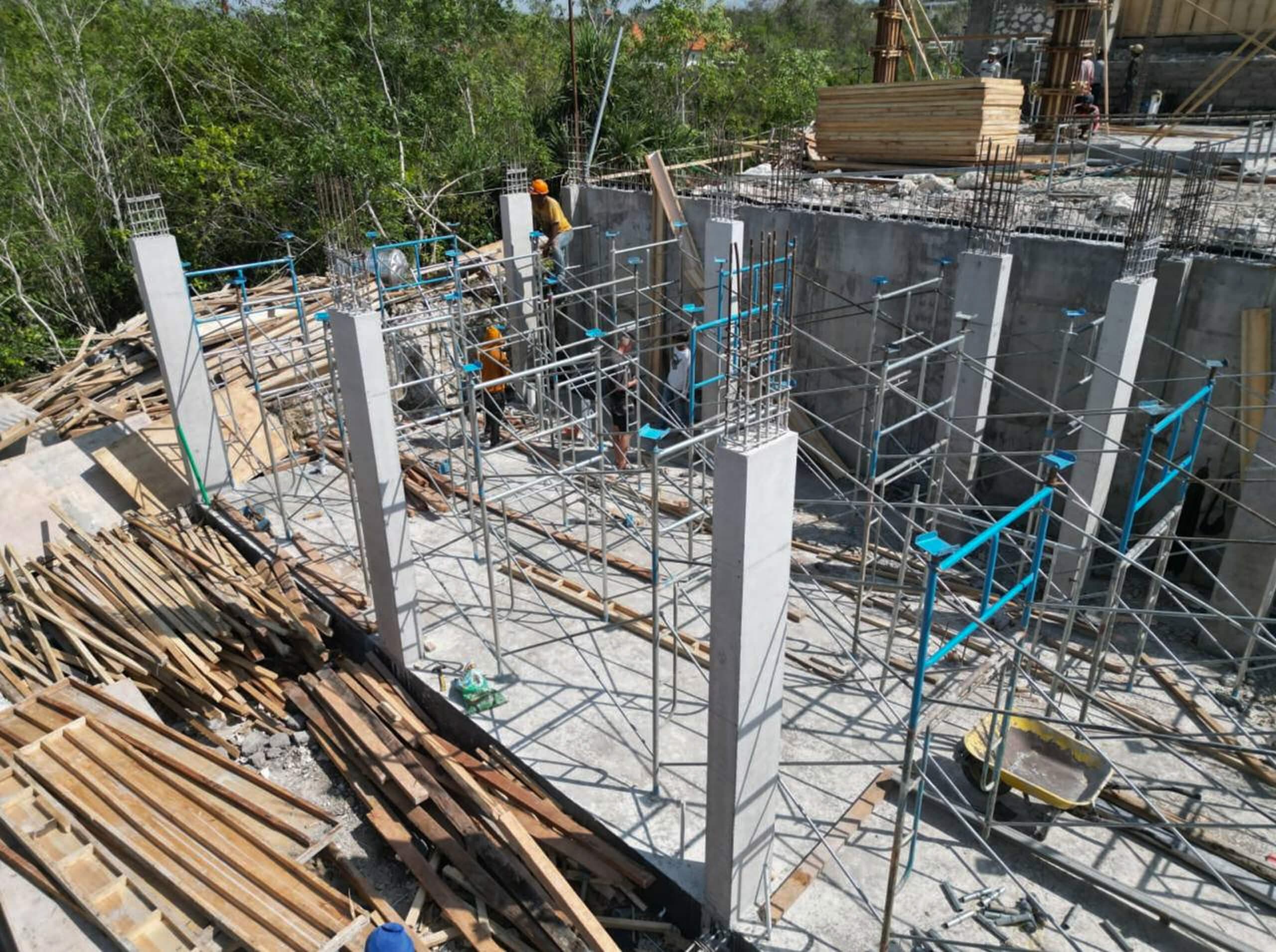 Construction progress — basement columns and walls with rebar on site — Frigate Bali