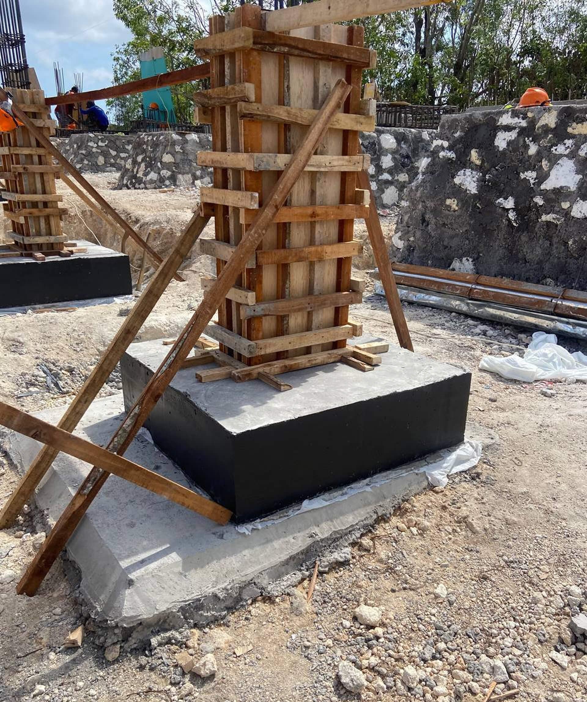 Construction progress — timber column formwork on a concrete foundation — Frigate Bali
