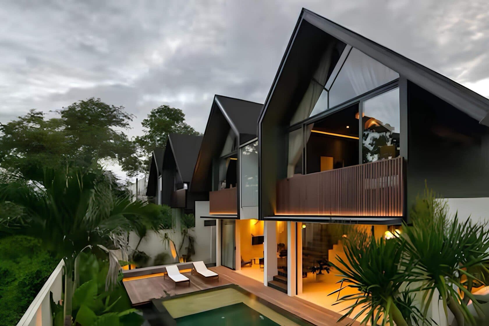Row of modern gable-roof villas with glass walls and pool in Bali — Frigate Bali